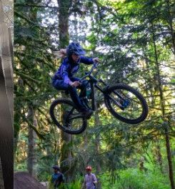 Rider jumping a bike on a forest trail