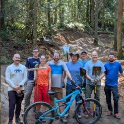 Evergreen volunteer trail crew with a bike on the trail